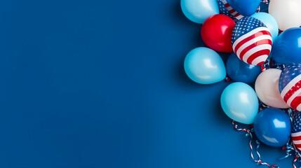 Colorful balloons on blue background with copy space. Flat lay.