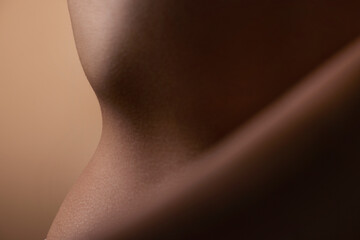 Healthy, skin and body of woman closeup for beauty, cosmetics or wellness in brown background in...