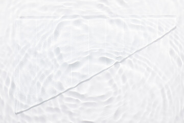 Water white surface abstract background. Waves and ripples texture of cosmetic aqua moisturizer with bubbles and transparent ice glass inside.