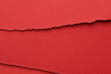 Art collage of pieces of ripped paper with torn edges. Sticky notes collection red colors, shreds of notebook pages. Abstract background.