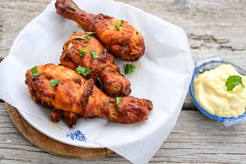 Crispy  deep fried home made    chicken   legs  Breaded  with  almond flour chicken  breast fillets  with chilly peppers and fresh   basil on wooden rustic background. Ketogenic diet food