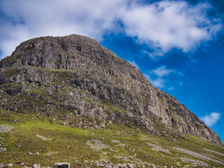The peak of Uisgnabhal Mor towers over Glen Meavaig, home of the North Harris Eagle Observatory in...