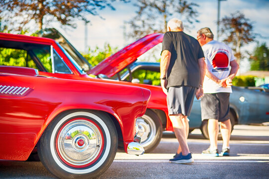 Classic American cars on display at vintage automobile cruise-in.