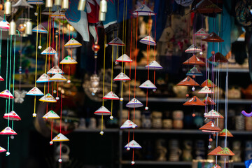Cone-shaped wind chimes at an arts and crafts store.