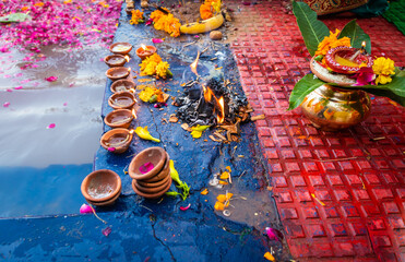 homa or havan at river shore in india for Hindu religious rituals for god during festival