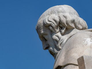 Plato bust marble statue, the ancient Greek philosopher, isolated on clear blue sky background. Travel to Athens, Greece.