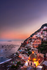 Beautiful sunset view of Positano with the church, Amalfi Coast, Italy - obrazy, fototapety, plakaty