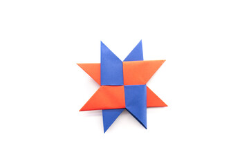 Paper ninja star on a white background. origami star. paper crafts