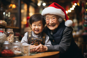 old grandmother holding a baby in christmas. - obrazy, fototapety, plakaty