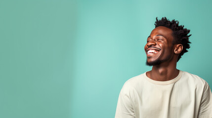 Fototapeta premium African male smiling on the pastel background