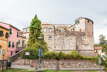 Fototapeta na wymiar Dario Capolicchio square with a view to the San Francesco Tower in Sarzana, Province of La Spezia, Liguria, Italy