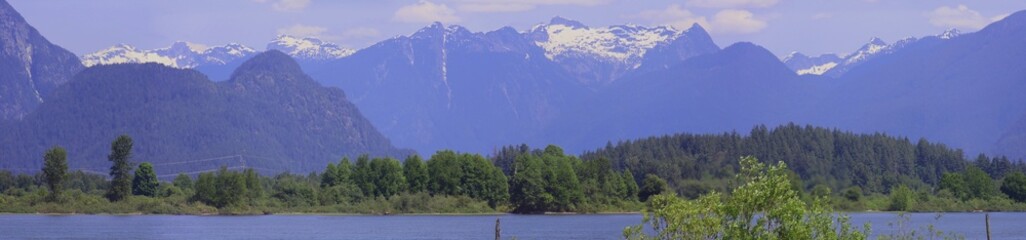 Early spring panorama of Cascadia Mountains