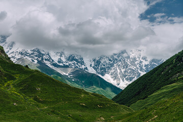 Fototapeta premium View of the valley of Shkhara, the highest mountain in Georgia. Svaneti, Georgia. Trekking from Ushguli to Shkhara Glacier. 