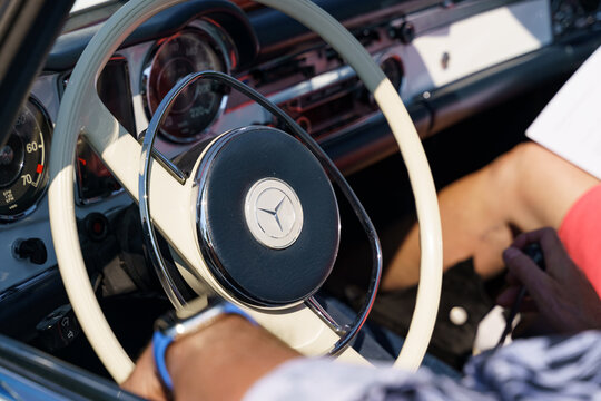 A vintage Mercedes-Benz 280 SL Pagoda. View of the steering wheel and dashboard. Selective sharpness.