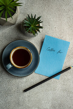 Mug of coffee and note