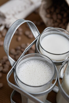 Fresh healthy bio natural Spanish horchata drink served in transparent glasses with tiger nuts around on the table. Still life