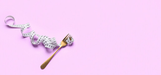 Fork and measuring tape on lilac background with space for text. Diet concept