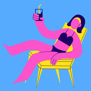 Girl bathing suit unbathing on a chaise lounge with a cocktail