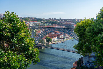 Beautiful colorful cityscape of Porto Portugal next to Duero river in Ribeira with dom luiz - obrazy, fototapety, plakaty