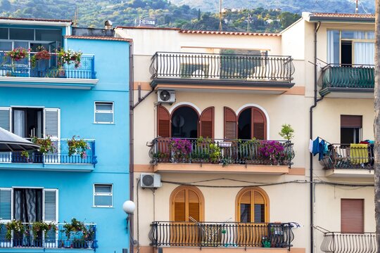 Multicolored traditional houses in the port area of Giardini Naxos in Sicily