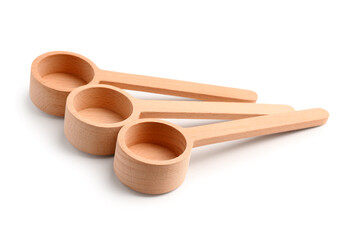Empty wooden scoops isolated on white background