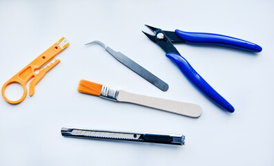 Forceps and a knife for working with radio electronics. Means for soldering wires.