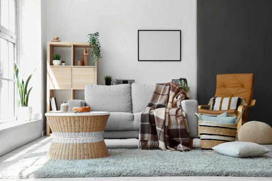 Modern Living Room Interior With Grey Sofa, Coffee Table, Blanket And Wicker Basket