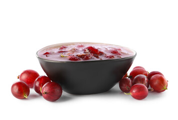 Bowl with tasty gooseberry jam on white background