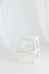 Fototapeta na wymiar White empty chair with white background