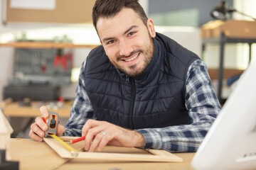 close up view of hardworking focused professional serious carpenter