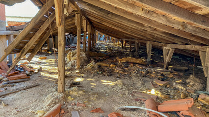 Interior view of a Roof in abandoned and demolished old building, tiles and construction rubble