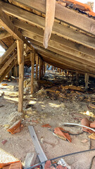 Interior view of a Roof in abandoned and demolished old building, tiles and construction rubble
