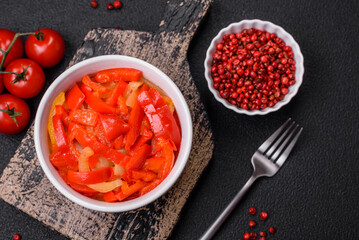 Delicious fresh saute sweet bell pepper slices with onion, salt, spices and herbs