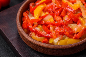 Delicious fresh saute sweet bell pepper slices with onion, salt, spices and herbs