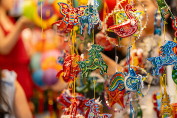 Decorated colorful lanterns hanging on a stand in the streets in Ho Chi Minh City, Vietnam during...