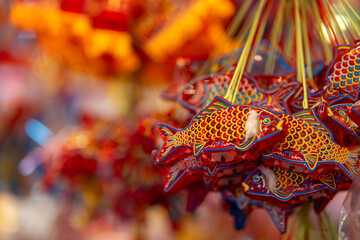 Decorated colorful lanterns hanging on a stand in the streets in Ho Chi Minh City, Vietnam during...