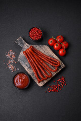 Delicious thin smoked hunting sausages with salt, spices and herbs