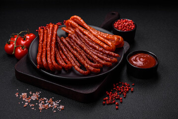 Delicious thin smoked hunting sausages with salt, spices and herbs