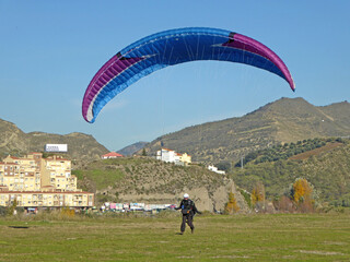 Paraglider landing at Cenes de la Vega in Spain