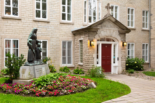 Quebec City, Quebec, Canada, August 28, 2023 - Statue&nbsp;of the Saint&nbsp;Marie&nbsp;of the Incarnation, founder of the&nbsp;Ursuline&nbsp;Order in Canada, in front of the 1641 convent at 18 Donnacona street&nbsp;in the old tow