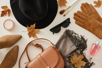 Effortlessly embrace the fall vibe in your wardrobe. Top view composition of fashionable hat, grey...