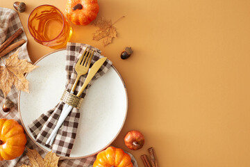 Elevate your table with a touch of autumnal beauty. Top view shot of plate, cutlery, tablecloth,...