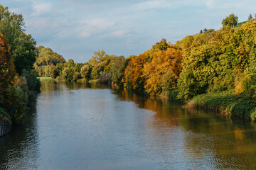 Autumn Landscape, Colored Trees Over The River, Beautiful Picturesque Background. Natural Paints. Beautiful View. River Autumn Trees Shore Sky. Mountain Landscape At The Lake In Autumn. Trees In