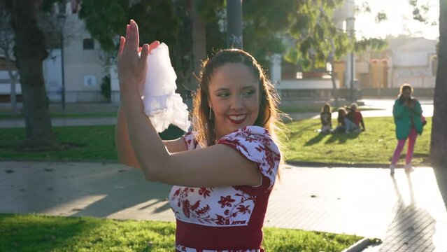 couples dressed in traditional huaso clothes clapping and dancing cueca