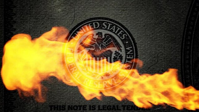 Smoothly approaching and luminous sign of the US Federal Reserve on an old hundred dollar bill with a jet of fire. Conspiracy theory. 4k conceptual grunge video.