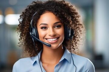 Call center or support staff. Woman with headphones in the office.