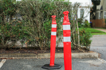 construction cone on the road signifies ongoing progress, caution, and temporary disruption in the...