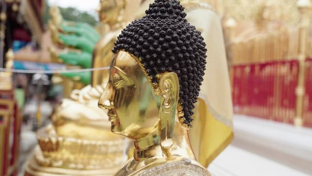side of a buddha's head at wat phra that doi suthep temple in chiang mai, thailand
