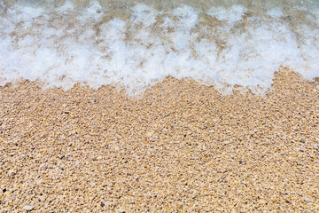 Seashore of small white pebbles on the beach in Oludeniz, blue lagoon. The cleanest beach with blue flag. Background