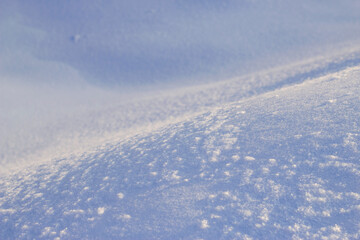 blue snow in the mountains in sunny frosty day in north country